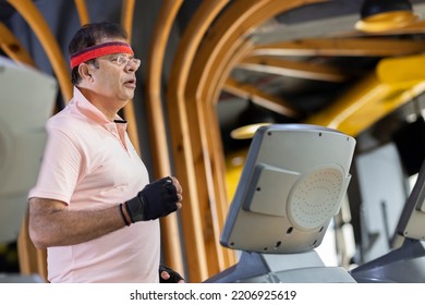 Senior Man Doing Cardio Workout In A Gym