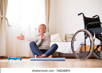 Senior Man Doing Exercise At Home.