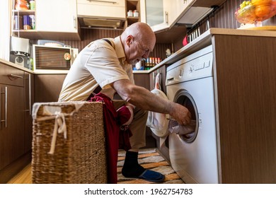 Senior Man Doing The Laundry At Home
