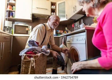 Senior Man Doing The Laundry At Home
