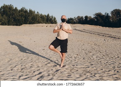 Senior Man Doing Yoga Exercises Man Wearing Medical Mask