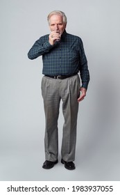 Senior Man Drinking A Glass Of Water