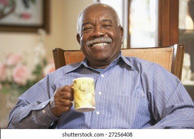 Senior man drinking hot beverage - Powered by Shutterstock