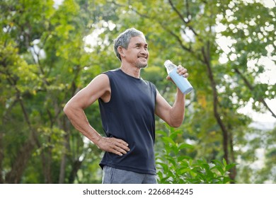 senior man drinking water after workout in the park for body refreshment, concept adult older drinking water substitutes while exercising  - Powered by Shutterstock