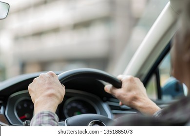 Senior Man Driving A Car