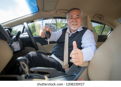 Senior Man Driving Car Show Car Keys And Thumb Up , Portrait Asian Old Elderly Male Driving To Work , Transport  Safety Concept.