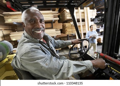 Senior Man Driving Forklift