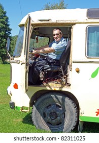 Senior Man Driving Old Vintage Russian Bus