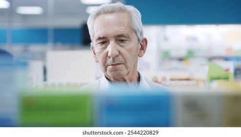 Senior man, drugs or shopping in pharmacy for medicine, wellness or thinking for supplement choice. Elderly customer, vitamins or looking at chemist shelf for pharmaceutical, product or reading label - Powered by Shutterstock