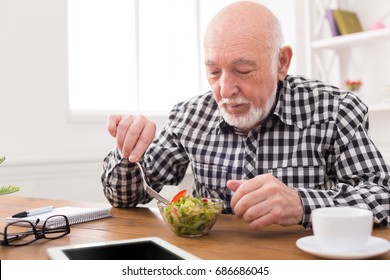 Senior Man Eating Fresh Salad. Mature Male Having Healthy Snack, Healthcare, Diet Concept