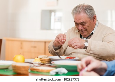 Senior Man Eating A Healthy Meal 