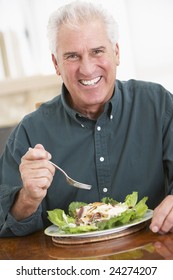 Senior Man Eating A Healthy Meal