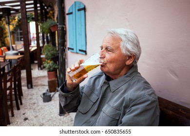 Senior man enjoying a glass of beer