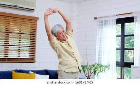 Senior man exercise at home, Happy elderly male stretching the body after workout, Healthy retirement old people training fit sport for body strength, wellness, wellbeing concept