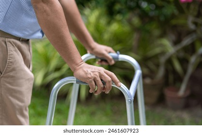 Senior man exercise walking in backyard.