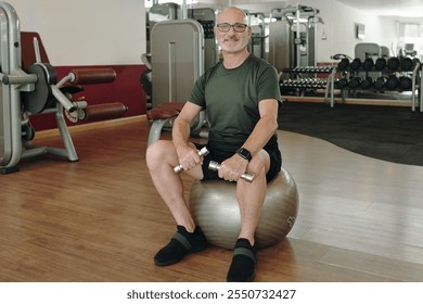 Senior Man Exercising with Dumbbells in Gym Setting - Powered by Shutterstock