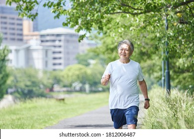 Senior man exercising in the green - Powered by Shutterstock