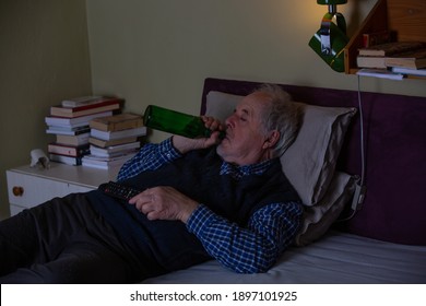 Senior Man Fell Asleep On The Sofa While Watching Tv At Night, Rest And Relax At Home