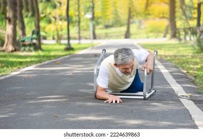 Senior Man Fell On His Walker While Practice Walking In The Park, Concept Elderly People Fall, Medical Health Care, Risk Management Of Fall