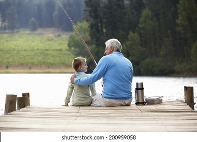 Senior Man Fishing With Grandson