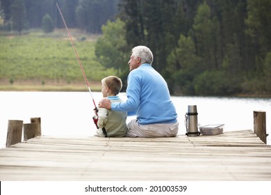 Senior Man Fishing With Grandson