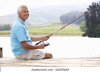 Senior Man Fishing On Jetty