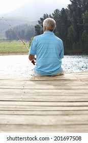 Senior Man Fishing On Jetty