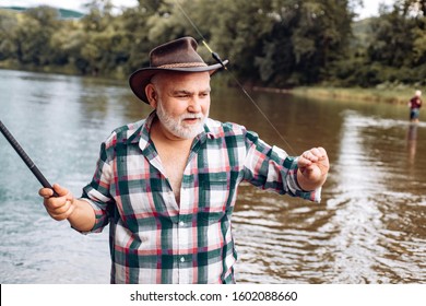 Senior Man Fishing. Fishing On The Lake. Fish On Hook. Master Baiter. Gone Fishing. Summer Vacation. Bearded Men Catching Fish. Slightly Older. Retirement Fishery