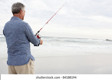 Senior Man Fishing In Sea