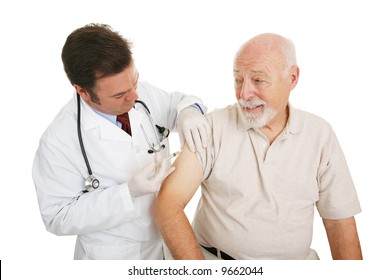 Senior Man Getting A Flu Shot From His Doctor.  Isolated On White.