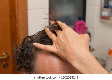 Senior Man Getting A Haircut At Home