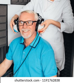 Senior Man Getting A Hearing Test At A Doctors Office, Audiometer Hearing Test