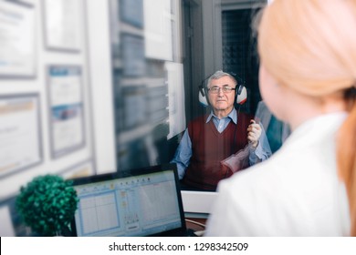 Senior Man Getting A Hearing Test At A Doctors Office,