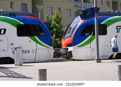 Senior Man Getting On Tilo Train At Railway Station Tenero, Canton Ticino, On A Sunny Summer Day. Photo Taken July 26th, 2022, Tenero, Switzerland.