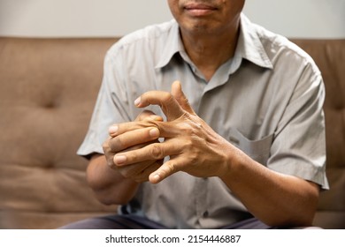 Senior Man Hand Suffering From Joint Pain With Gout Inflammation