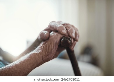 Senior man, hands together and support with cane for old age, osteoporosis or care in retirement home. Closeup of elderly, pensioner or male person with a disability or walking stick for stability - Powered by Shutterstock