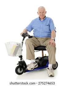 A senior man happily looking at the viewer from his electric scooter.  On a white background.