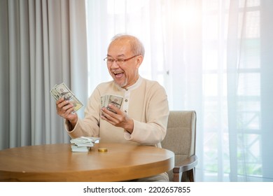 Senior Man Happy With Money,Holding Dollar Banknotes,Celebrating Achievement With Happy Smile.