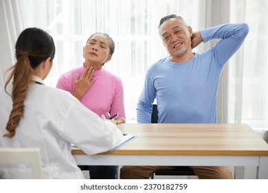 senior man have a neck pain when to visit a doctor in the hospital - Shutterstock ID 2370182759