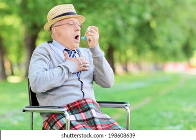 Senior Man Having An Asthma Attack In A Park