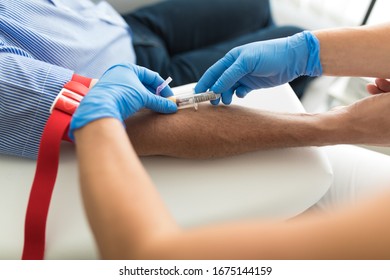 Senior Man Having A Blood Test Done By A Nurse