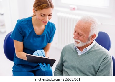 Senior man having dental checkup at dentist office, consulting with doctor about necessary procedures - Powered by Shutterstock