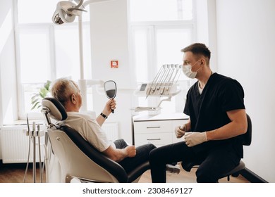 Senior man having dental treatment at dentist's office - Powered by Shutterstock