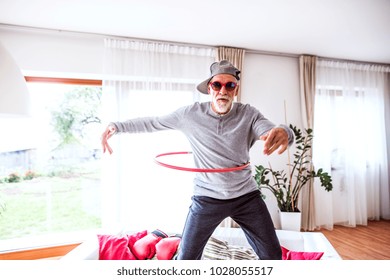 Senior man having fun at home.