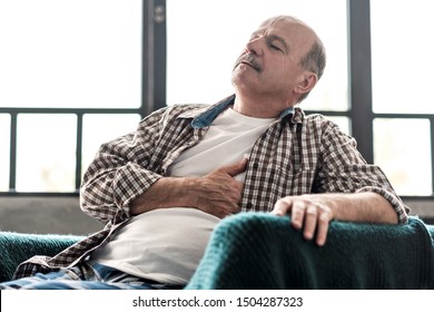 Senior Man Is Having Heart Attack. Poor Health At Old Age Concept