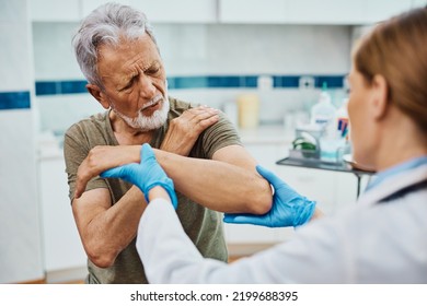 Senior Man Having Medical Exam By Female Doctor In The Hospital. 