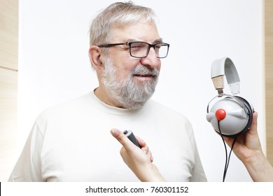 Senior Man With Headphones - Hearing Test 