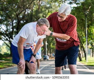 Senior man helping his friend - Powered by Shutterstock