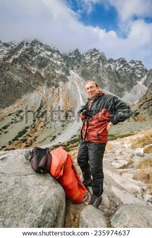 Similar – Image, Stock Photo Backpacker resting.