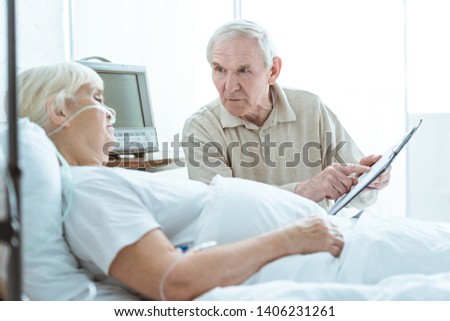 Similar – Female doctor comforting older female patient